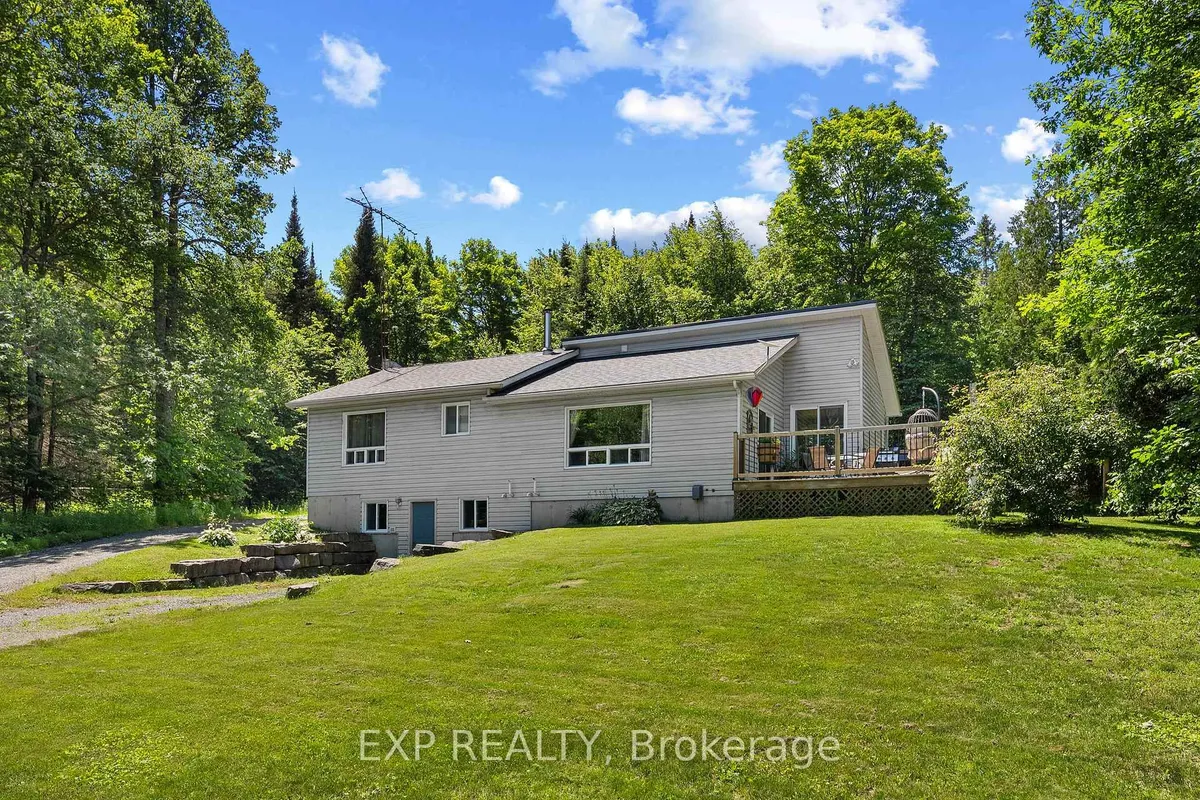 Detached Barry's Bay home with visible garage frontage