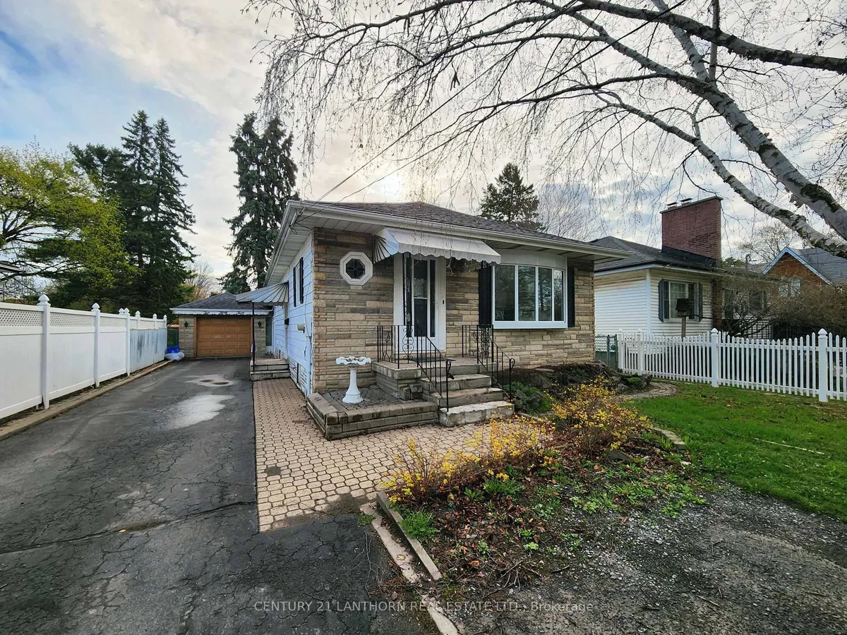 Detached Belleville home with front-facing garage door