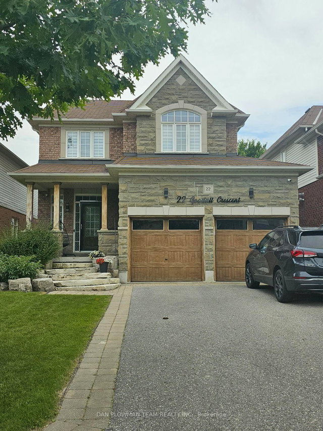 Bowmanville detached home with two wood-look garage doors