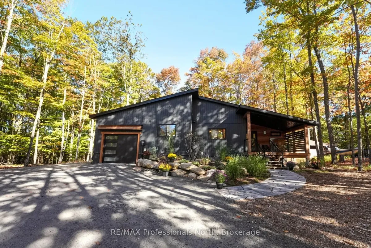 Detached Haliburton home with garage visible from the front drive