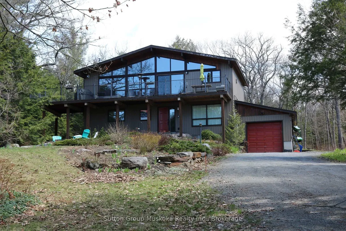 Detached Huntsville home with front garage and driveway