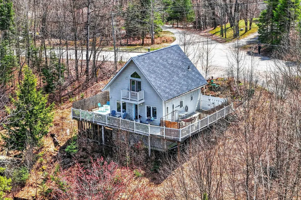 Detached Huntsville home with garage on a sloped residential lot