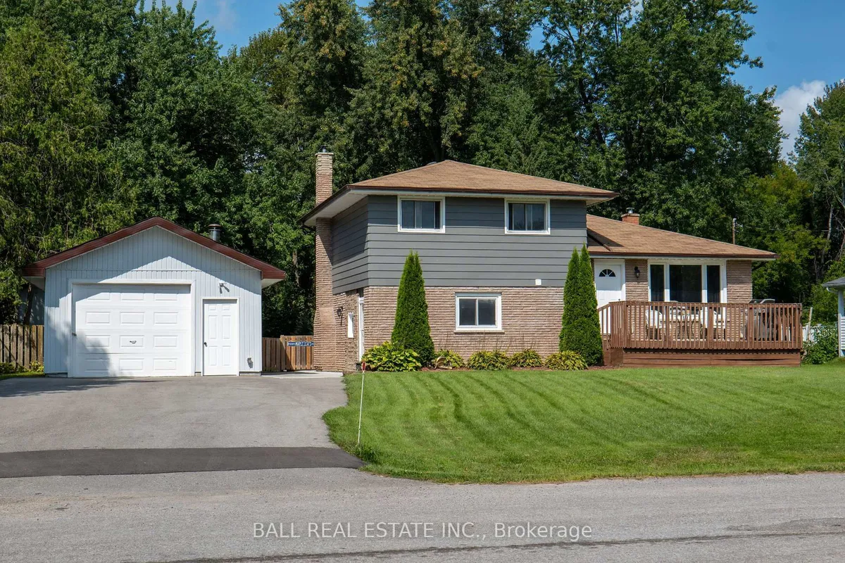 Detached Kawartha Lakes home with garage visible from the street
