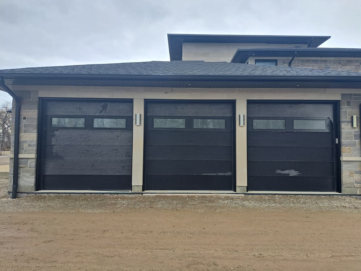 Black double garage door with broad horizontal panels