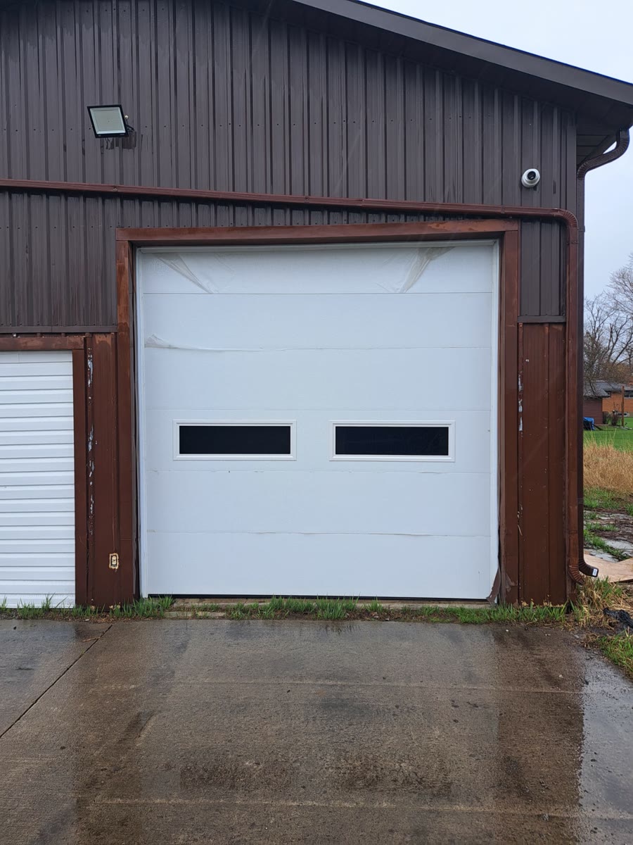White modern single garage door with two dark window bands