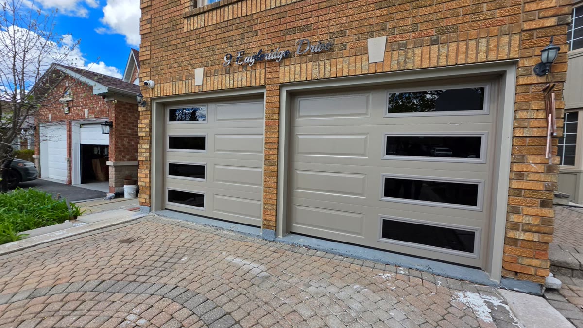 White double garage doors with black window inserts