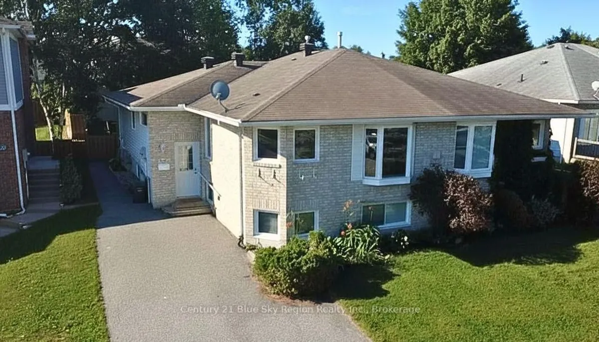 Detached North Bay home with garage visible from the front lot