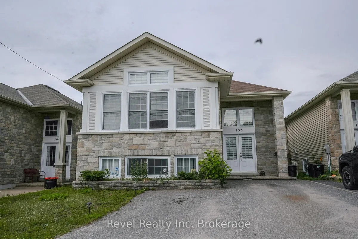 Detached North Bay home with front garage and driveway