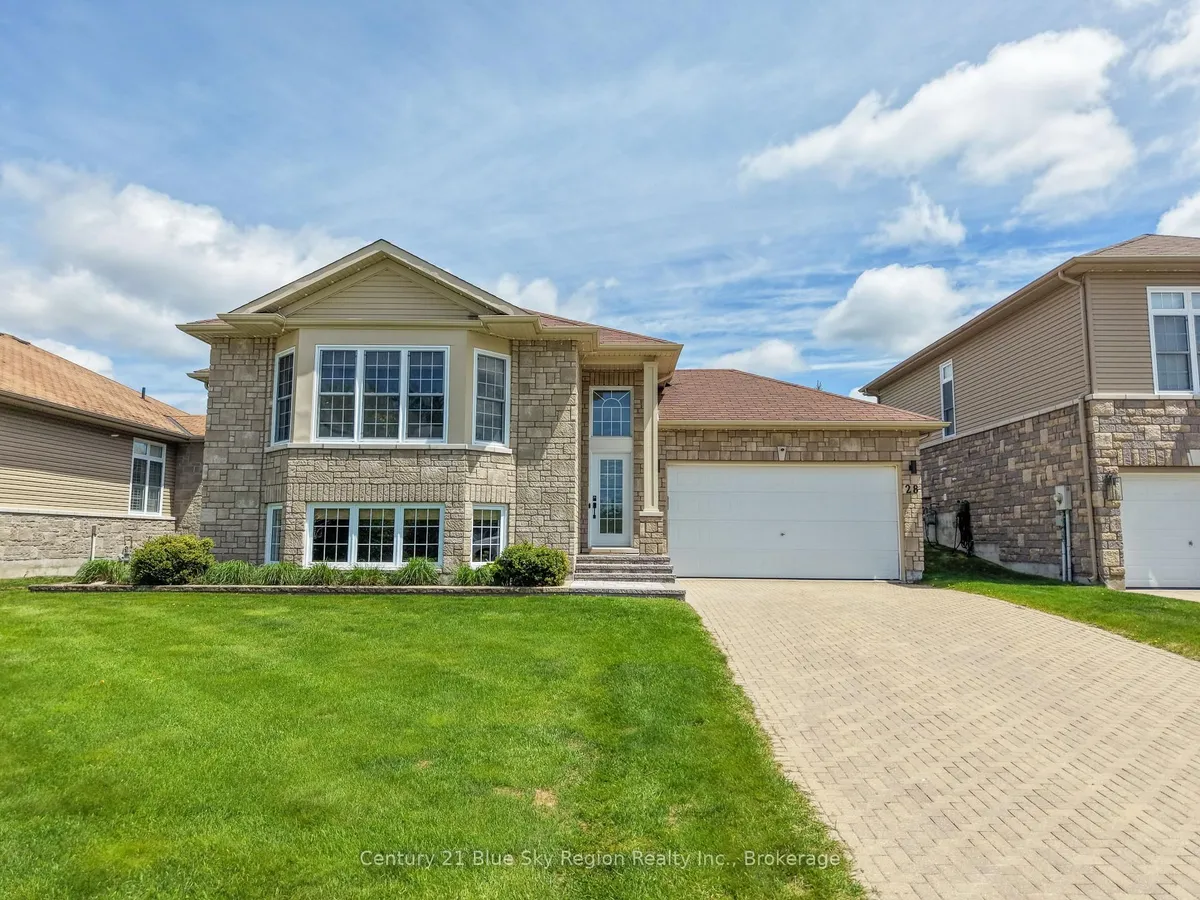 Detached North Bay home with garage door facing a broad driveway