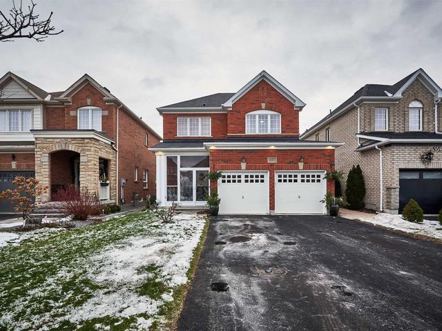 Detached Oshawa home with two white garage doors