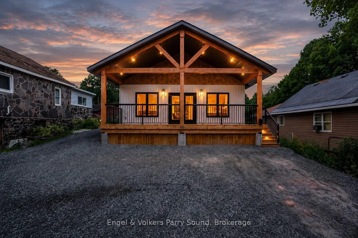 Detached Parry Sound home with front-facing garage door