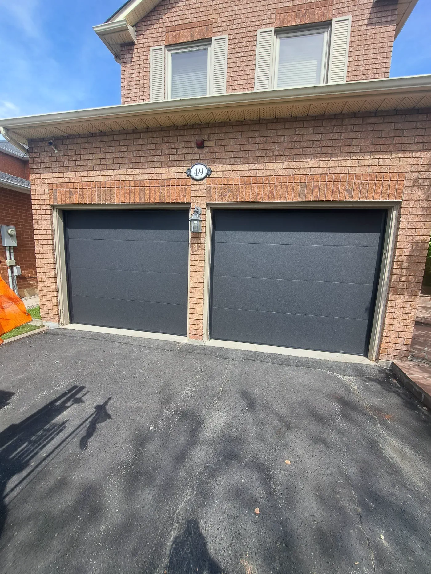 RedOak job archive photo showing garage-door work near barrie