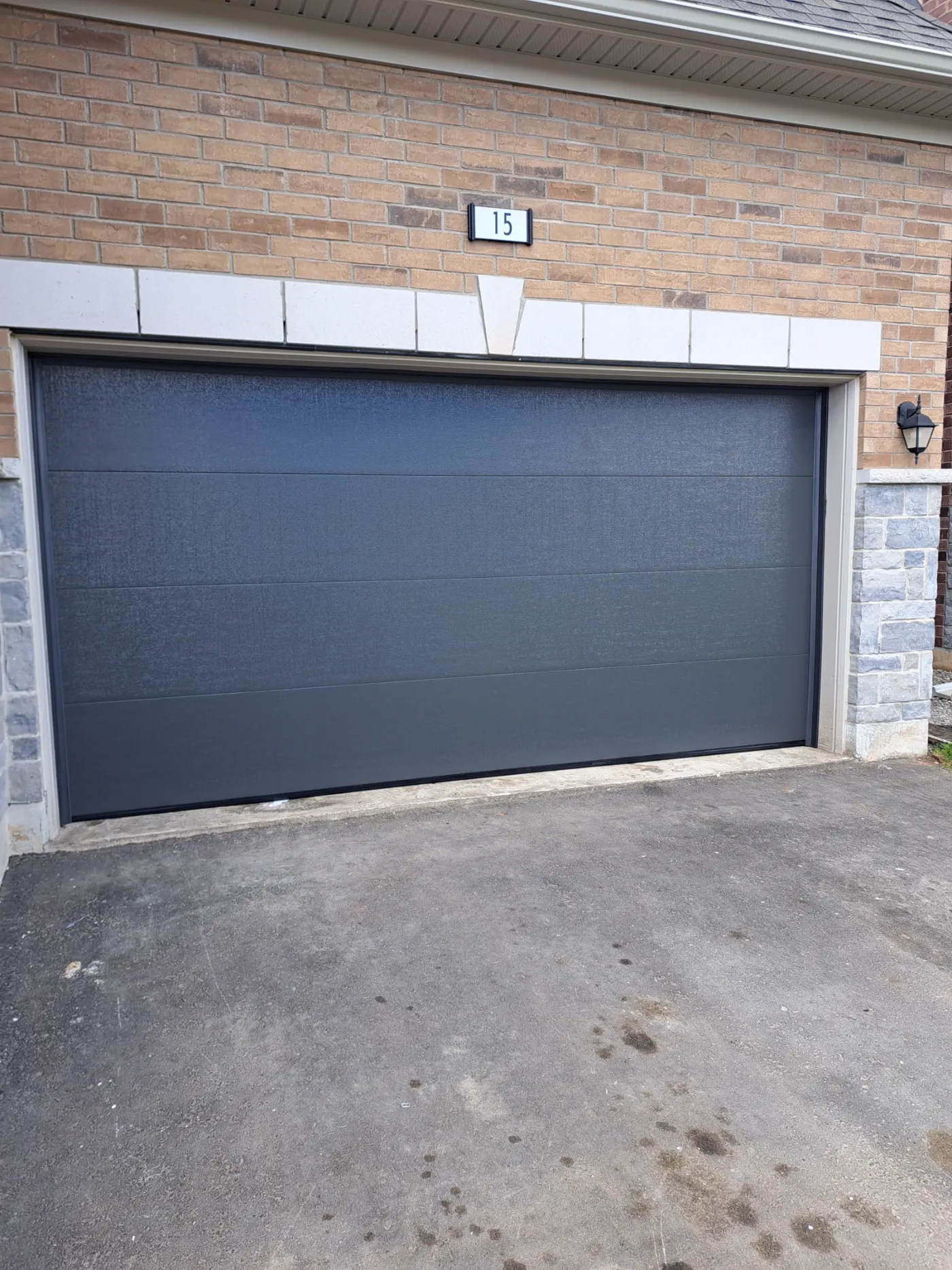 RedOak job archive photo showing garage-door work near innisfil