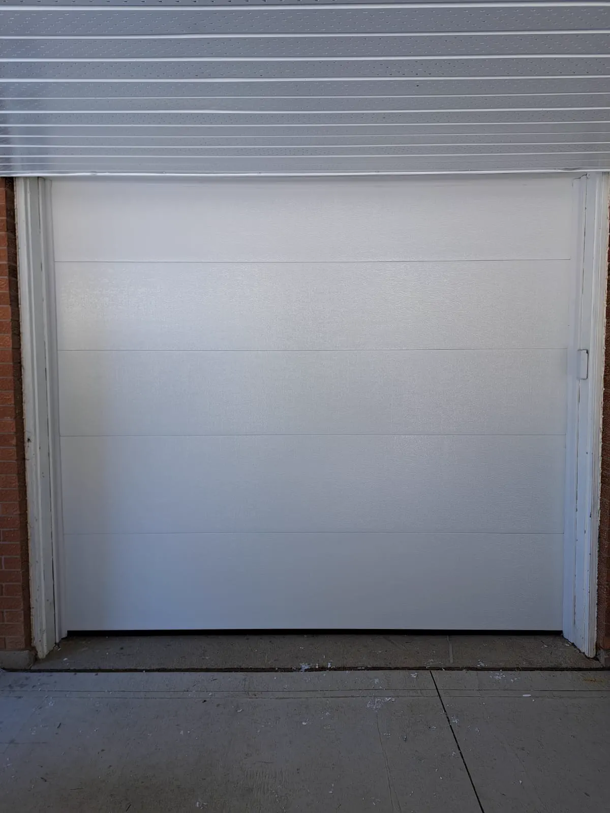 RedOak job archive photo showing garage-door work near markham