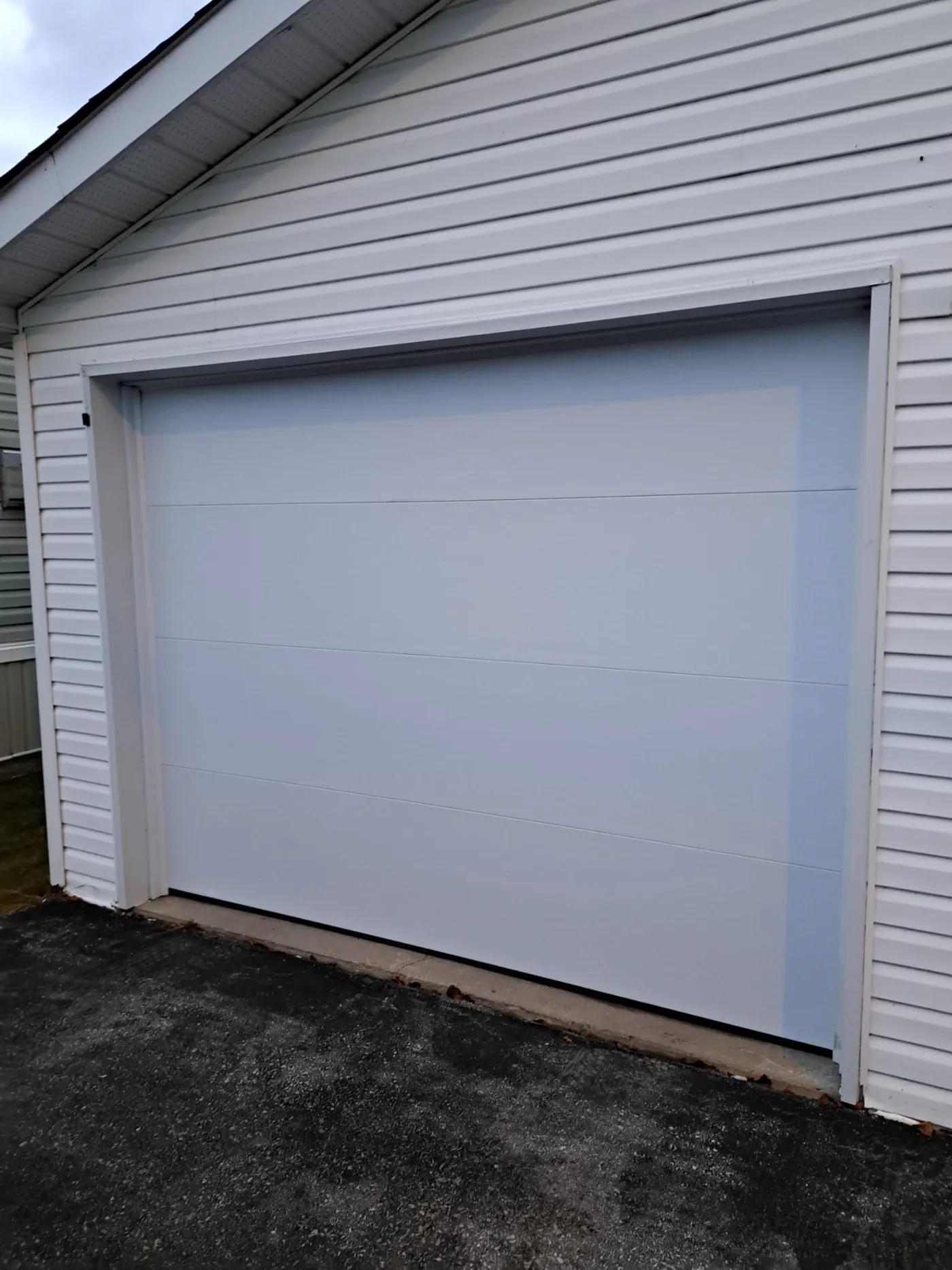 RedOak job archive photo showing garage-door work near midland