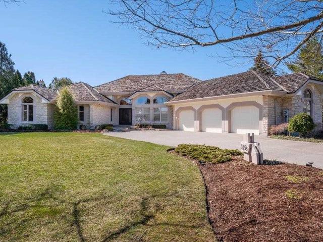 Detached Waterloo bungalow with multiple garage doors