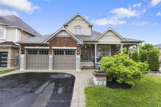 Detached Whitby home with two taupe garage doors
