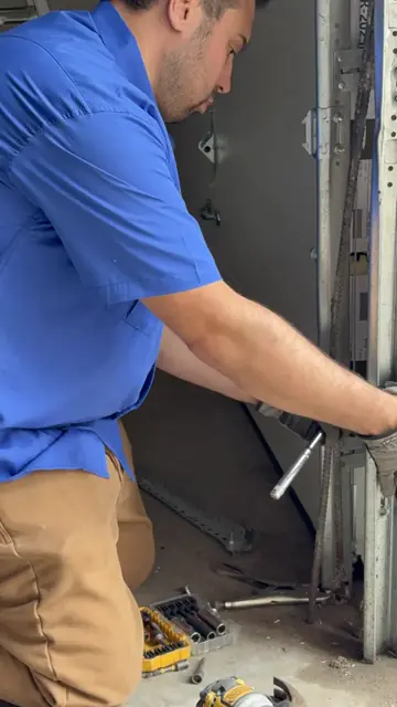 RedOak technician repairing garage door hardware